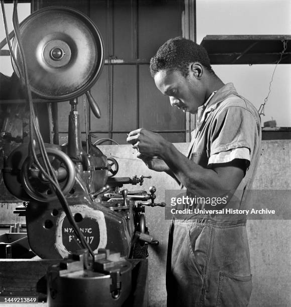 Young Adult Man receiving training as a turret-lathe Worker, National Youth Administration Work Center, Brooklyn, New York, USA, Fritz Henle, U.S....