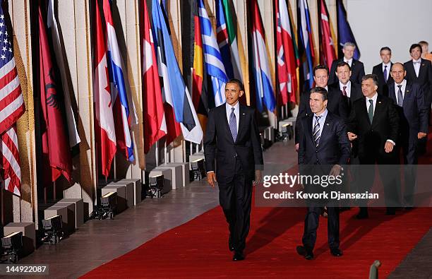 President Barack Obama and NATO Secretary General Anders Fogh Rasmussen lead world leaders as they walk under the Soldier Field colonnades to the...