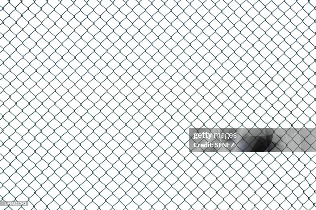 Closeup wire fence aginst white background