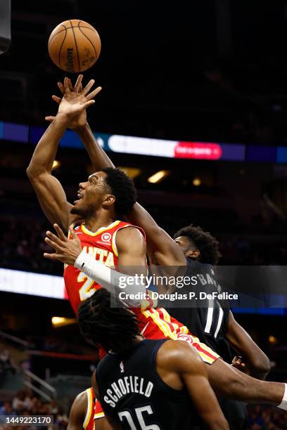 Trent Forrest of the Atlanta Hawks drives to the net as Mo Bamba of the Orlando Magic defends during the second quarter at Amway Center on December...