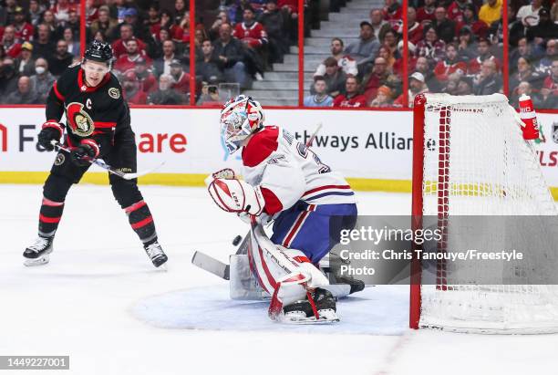Brady Tkachuk of the Ottawa Senators scores against Sam Montembeault of the Montreal Canadiens during the second period at Canadian Tire Centre on...