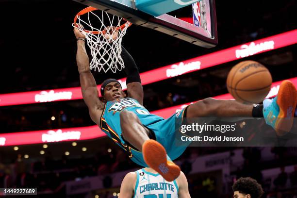Jalen Duren of the Detroit Pistons dunks during the second half against the Charlotte Hornets at Spectrum Center on December 14, 2022 in Charlotte,...