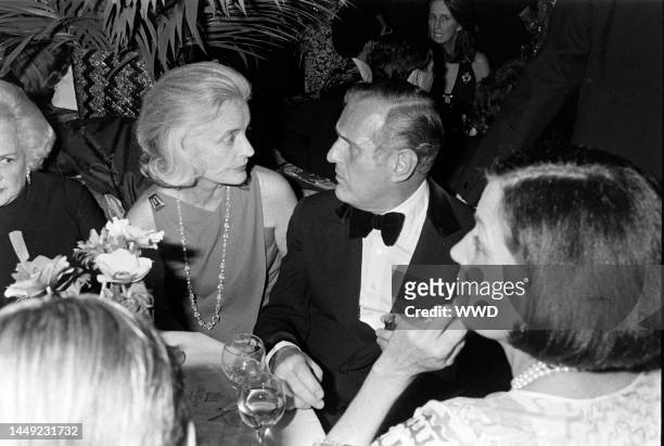 Nancy "Slim" Keith aka Lady Keith, John Richardson, and Maxime de la Falaise attend a charity party at the Carlyle Restaurant in New York City on...