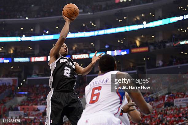 Kawhi Leonard of the San Antonio Spurs shoots the ball over DeAndre Jordan of the Los Angeles Clippers in the first quarter in Game Four of the...