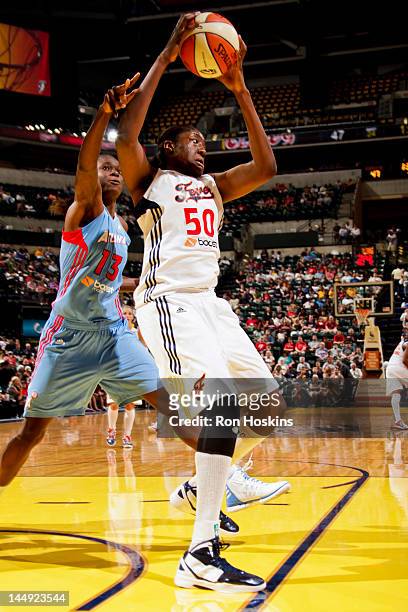 Jessica Davenport of the Indiana Fever grabs a rebound against Aneika Henry of the Atlanta Dream at Bankers Life Fieldhouse on May 19, 2012 in...