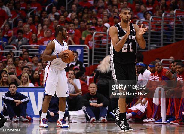 Tim Duncan of the San Antonio Spurs reacts alongside Chris Paul of the Los Angeles Clippers in the first quarter in Game Four of the Western...