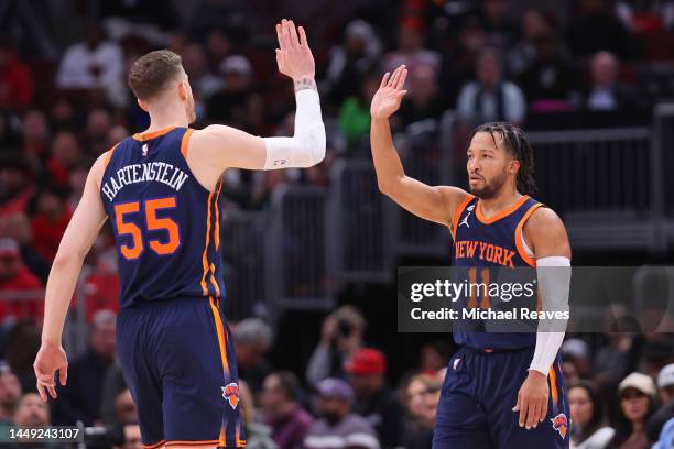 Isaiah Hartenstein and Jalen Brunson of the New York Knicks celebrate a basket against the Chicago Bulls during the second half at United Center on...
