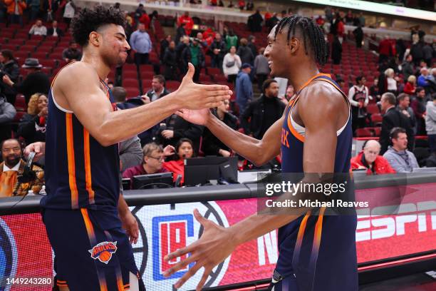 Quentin Grimes and Immanuel Quickley of the New York Knicks celebrate after defeating the Chicago Bulls at United Center on December 14, 2022 in...