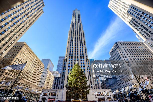 View of 30 Rockefeller Center with the annual Christmas tree in Rockefeller Plaza on December 14, 2022 in New York City.