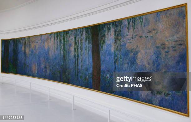 Claude Monet . French impressionist painter. The Water Lilies: Morning with Willows, ca. 1915-1926. Oil on canvas . Orangerie Museum. Paris. France.