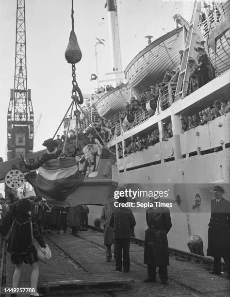 Saint Nicholas and Zwarte Piet visit the emigrant ship the Groote Beer, December 4, 1954.
