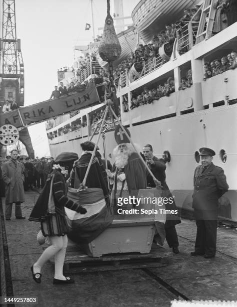 Saint Nicholas and Black Pete visit the emigrant ship Groote Beer, December 4, 1954.