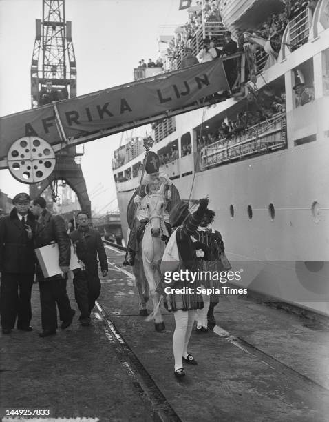Saint Nicholas and Black Pete pay a visit to the emigrant ship Groote Beer, December 4, 1954.