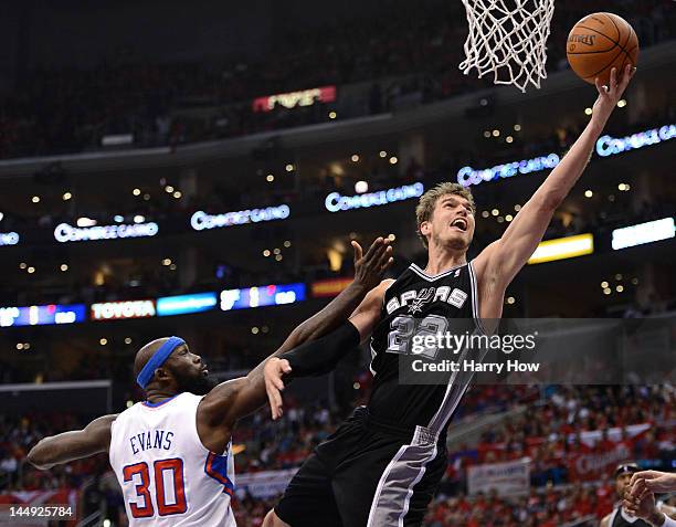 Tiago Splitter of the San Antonio Spurs goes up for a shot against Reggie Evans of the Los Angeles Clippers in the second quarter in Game Four of the...