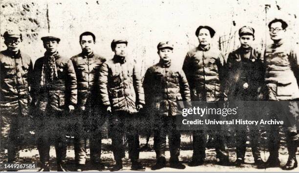 Group photo of Chinese Communist leaders in Yan'an. From the left: Zhang Wentian, Kang Sheng, Zhou Enlai, Kai Feng, Wang Ming, Mao Zedong, Ren Bishi,...