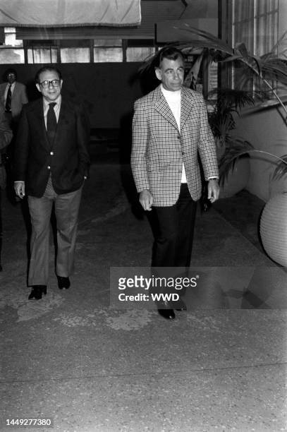 Kirk Kerkorian and Frank Rosenfelt attend a screening in Hollywood, California, on April 15, 1976.