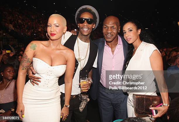 Model Amber Rose, rapper Wiz Khalifa, Mike Tyson and Lakiha 'Kiki' Tyson attend the 2012 Billboard Music Awards held at the MGM Grand Garden Arena on...