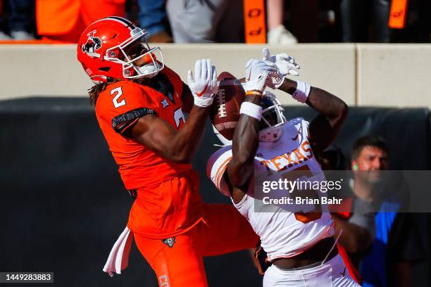 Defensive back D'Shawn Jamison of the Texas Longhorns breaks up a pass to wide receiver Talyn Shettron of the Oklahoma State Cowboys on a free play...