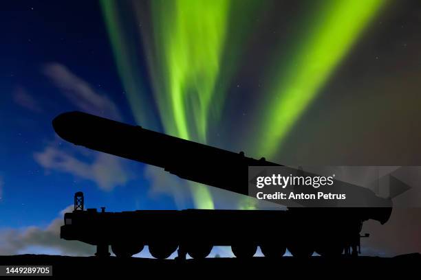 topol-m intercontinental ballistic missile on the background of northern lights - intercontinental ballistic missile stock pictures, royalty-free photos & images