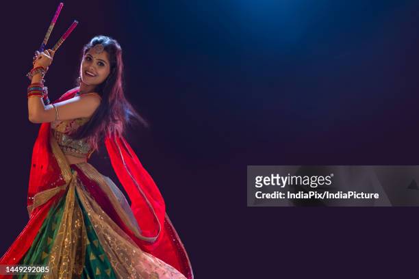 gujrati woman performing garba on stage - navratri festival celebrations stock pictures, royalty-free photos & images