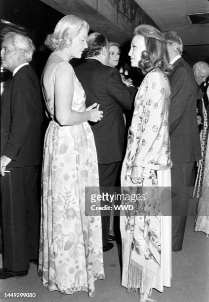 Guest and Helen Gurley Brown attend a party at Le Poulailler in New York City on May 24, 1976.