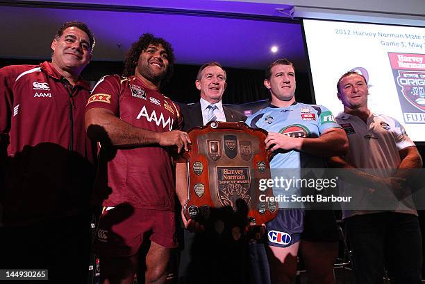 Queensland coach Mal Meninga and Sam Thaiday along with New South Wales captain Paul Gallen and coach Ricky Stuart pose with Victorian Minister for...