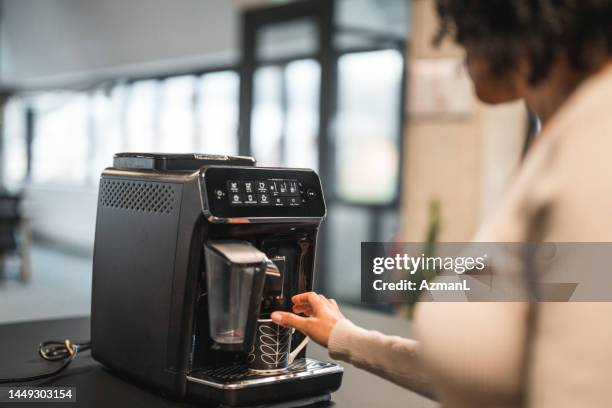 Someone Using The Machine 16,432 Person Using Coffee Machine Stock Photos, High-Res Pictures, and ...