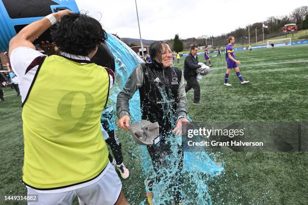 Head coach Julianne Sitch of the University of Chicago Maroons celebrates with her team after defeating the the Williams College Ephs to win the...