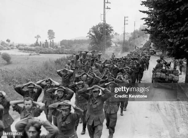 Column of thousands of surrendered prisoners of war from the German 7th Army captured by the United States First Army at Avranches during Operation...