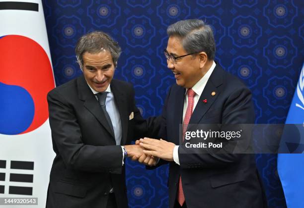 International Atomic Energy Agency Director General Rafael Grossi shakes hands with South Korean Foreign Minister Park Jin during their meeting at...