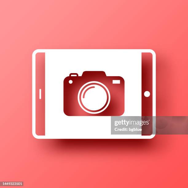 tablet pc with camera. icon on red background with shadow - bright camera flash stock illustrations