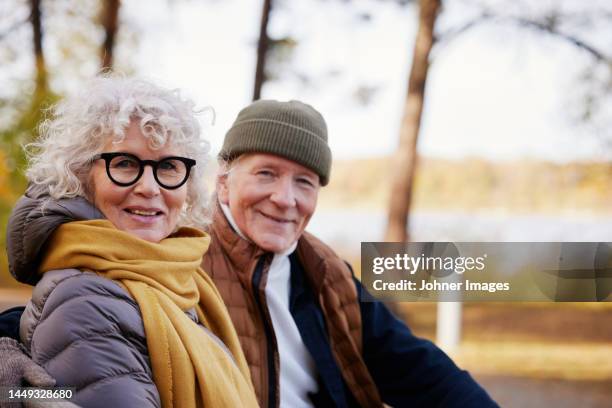 senior couple resting in park - gray hair couple stock pictures, royalty-free photos & images