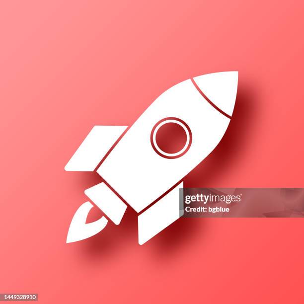 rocket. icon on red background with shadow - missile fire stock illustrations