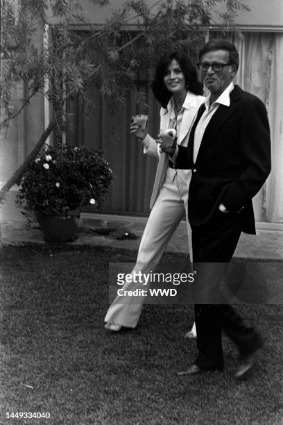 Cherie Latimer and Freddie Fields attend a party in Los Angeles, California, on July 22, 1976.