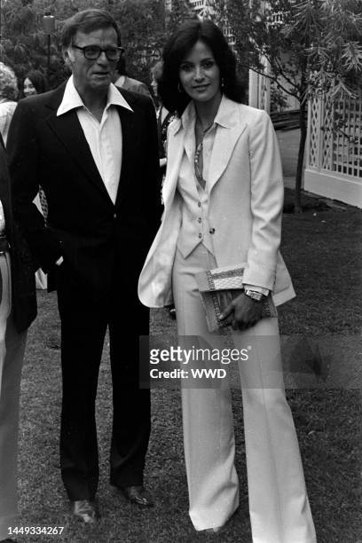Freddie Fields and Cherie Latimer attend a party in Los Angeles, California, on July 22, 1976.