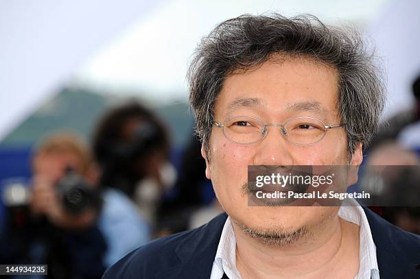 Director Sang-soo Hong poses at the "Da-reun Na-ra-e-suh" photocall during the 65th Annual Cannes Film Festival at Palais des Festivals on May 21,...