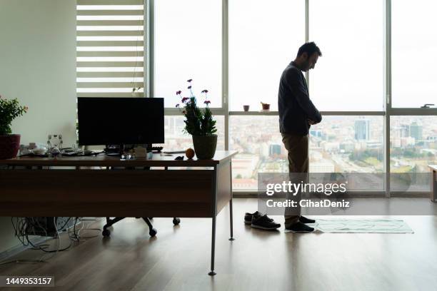 officer praying in office room - namaz stock pictures, royalty-free photos & images