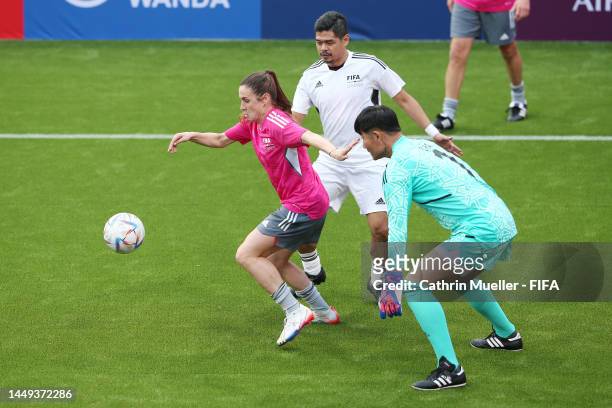 Heather O'Reilly of Northern Bears is closed down by Bambang Pamungkas of East Tigers during the FIFA Legends Cup match between Northern Bears and...