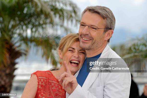 Actor Lambert Wilson and actress Anne Consigny pose at "Vous N'avez Encore Rien Vu" Photocall during the 65th Annual Cannes Film Festival at Palais...