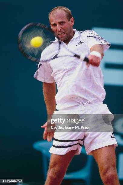 Thomas Muster from Austria plays a backhand return to Fabrice Santoro of France during their Men's Singles Second Round match at the Monte Carlo Open...