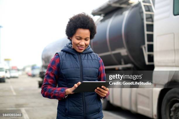 female fuel truck driver - gas truck stock pictures, royalty-free photos & images