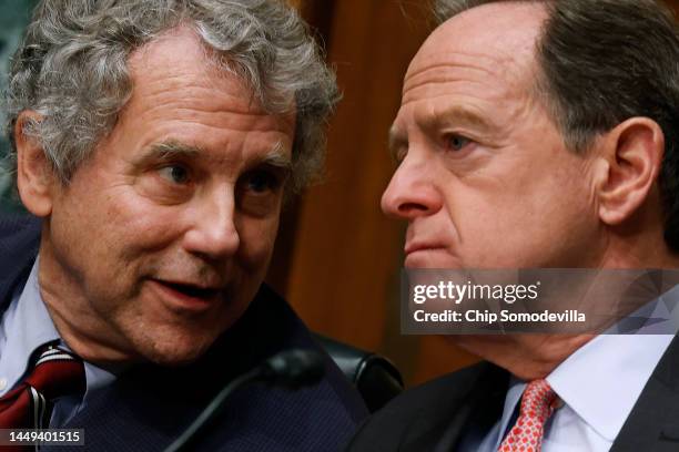 Senate Banking, Housing and Urban Affairs Committee Chairman Sherrod Brown talks with ranking member Sen. Pat Toomey during a hearing about the...