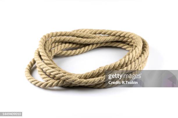 twisted thick ship ropes with knot isolated background - string fotografías e imágenes de stock