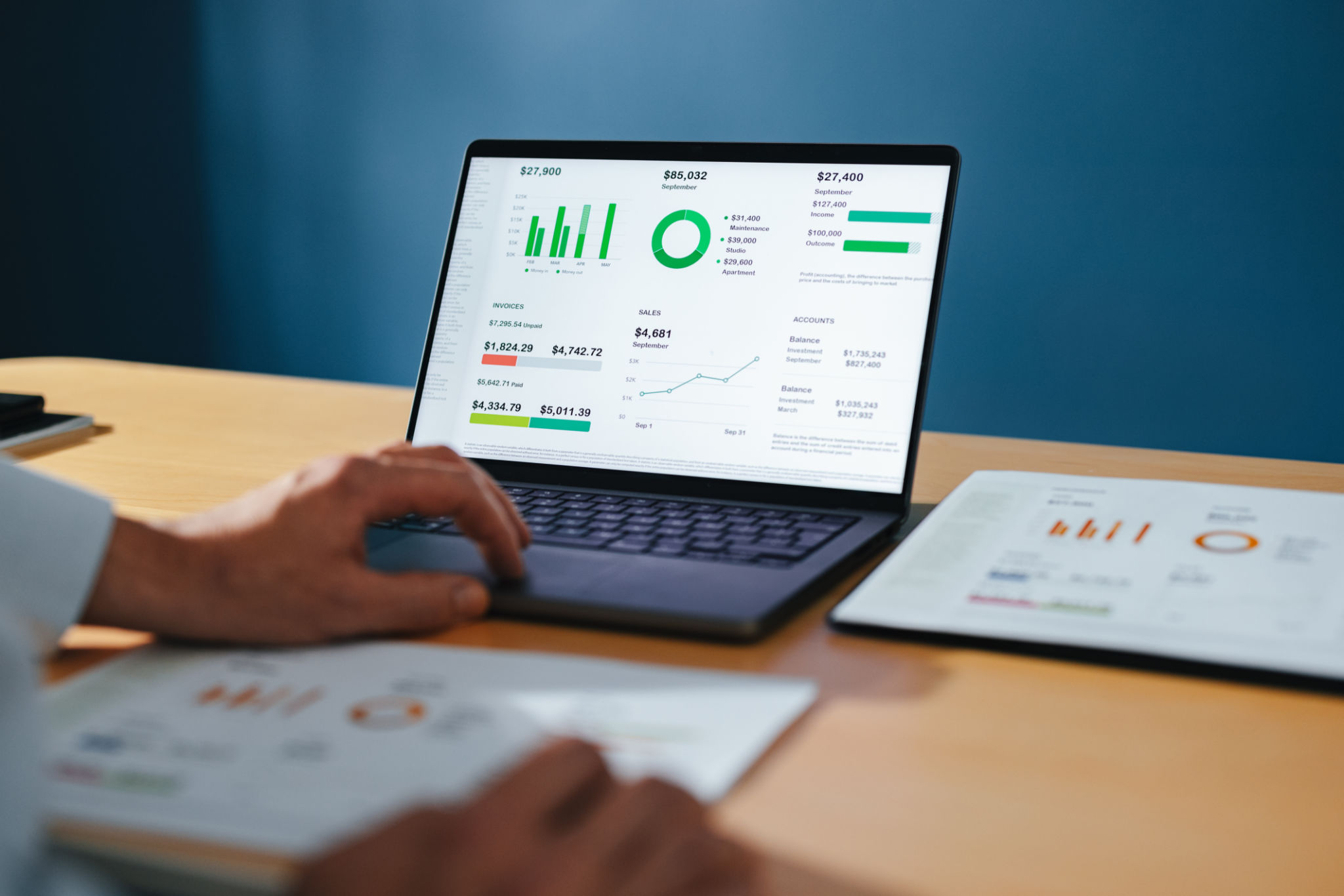 An Anonymous Businessman Working On A Laptop Computer At Home An Anonymous Businessman Working On A Laptop Computer At Home