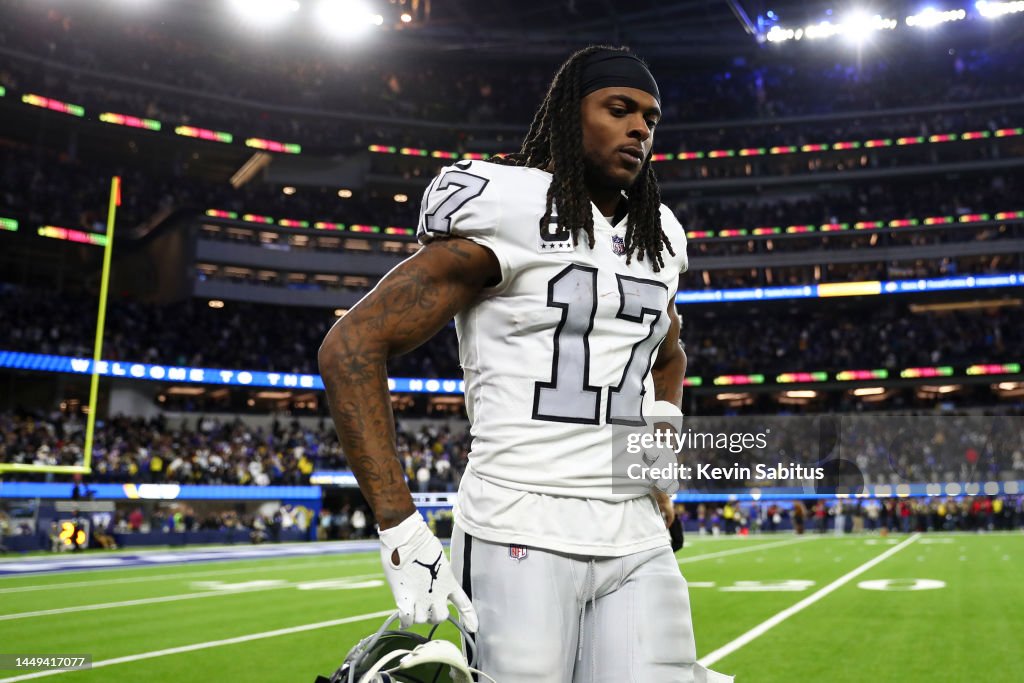 Devante Adams Rams Davante Adams of the Las Vegas Raiders walks to the sidelines after a ...