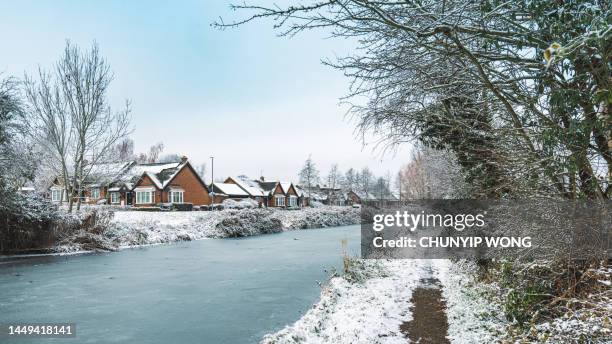 canal captured during snowfall in winter - basingstoke canal stock pictures, royalty-free photos & images