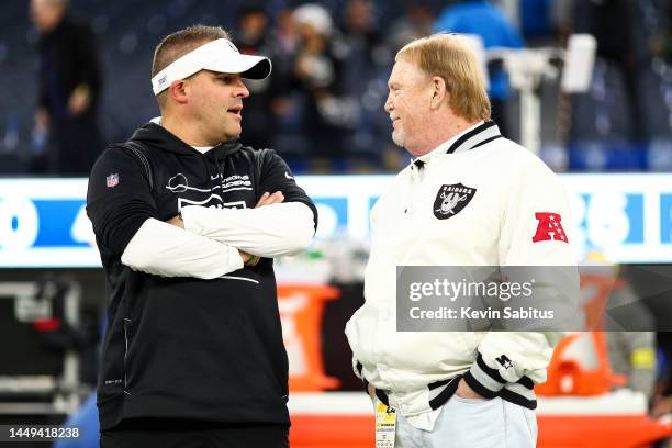 Head coach Josh McDaniels of the Las Vegas Raiders talks with owner and managing general partner Mark Davis on the sidelines prior to an NFL football...