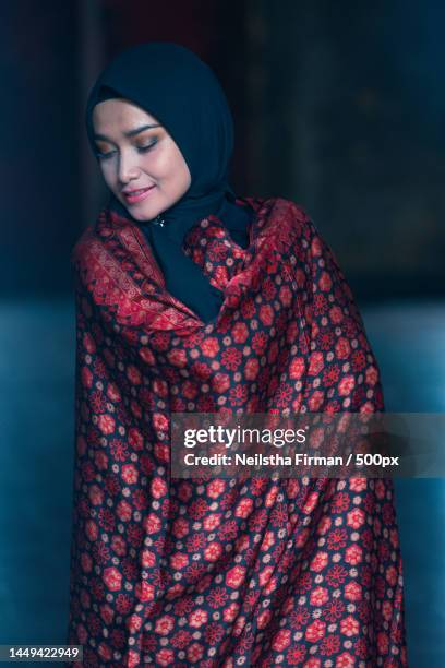 beautiful woman in black hijab wearing batik from jambi,indonesia,jakarta - batik dress stock pictures, royalty-free photos & images