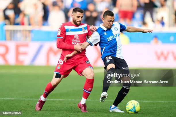 Gonzalo Escalante of Deportivo Alaves duels for the ball with David Lopez of RCD Espanyol during the La Liga Santander match between Deportivo Alaves...