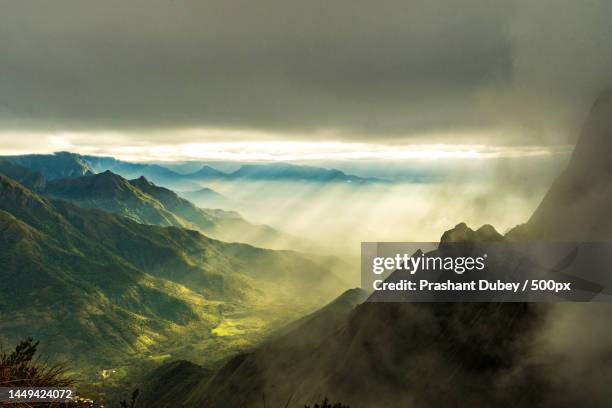scenic view of mountains against sky during sunset,munnar,kerala,india - munnar stock-fotos und bilder